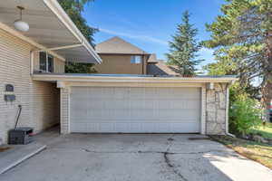 Garage with concrete driveway
