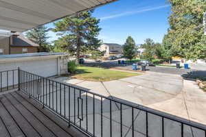 Terrace featuring a residential view and a lawn