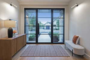 Doorway with wood finished floors