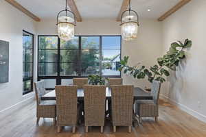 Dining room featuring light wood finished floors and a chandelier