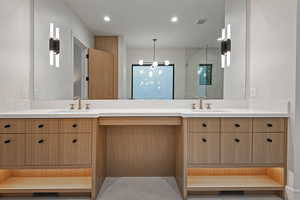 Bathroom featuring double vanity and recessed lighting