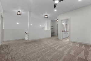 Unfurnished room with recessed lighting, light colored carpet, ceiling fan, and attic access