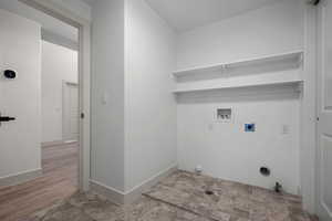 Washroom featuring hookup for a gas dryer and hookup for a washing machine