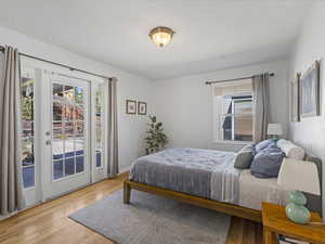 Bedroom featuring access to exterior and light wood-style flooring