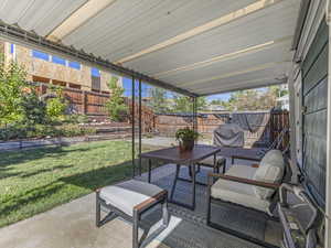 Fenced backyard with a patio area and area for grilling