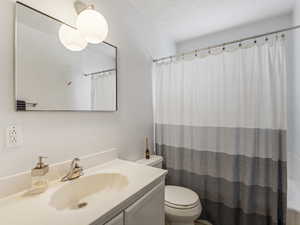 Bathroom with shower / bath combo and vanity