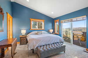 Bedroom featuring carpet, vaulted ceiling, a mountain view, access to outside, and recessed lighting