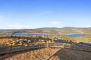 View of yard featuring a water and mountain view
