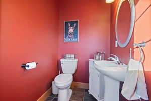 Bathroom with baseboards and toilet