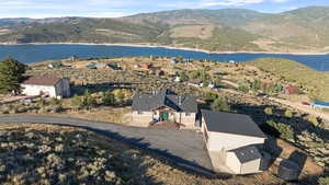 View of subject property featuring a water and mountain view