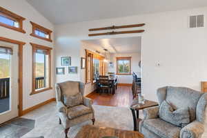 Carpeted living area with baseboards