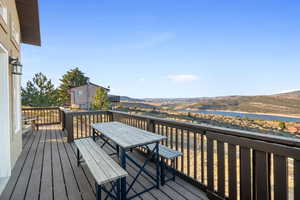Wooden terrace with a mountain view and outdoor dining area