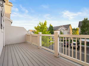 Wooden terrace featuring a residential view