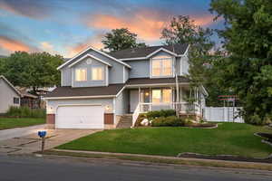 View of front of home featuring a porch, brick siding, an attached garage, concrete driveway, and a shingled roof