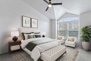 Carpeted bedroom with lofted ceiling and a ceiling fan