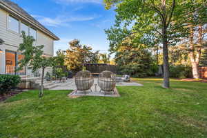 Fenced backyard featuring a patio area