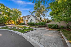 Traditional home featuring a gate