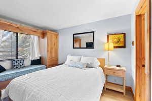 Bedroom with baseboards and carpet flooring