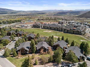 Aerial view of property's location with nearby suburban area
