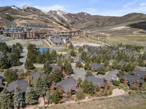 Aerial view of property's location with a mountainous background