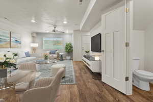 Living room featuring wood finished floors, ceiling fan, and a textured ceiling
