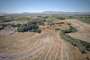 Aerial view of sparsely populated area with a mountain backdrop