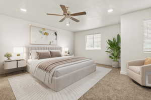 Bedroom featuring light colored carpet, a ceiling fan, and recessed lighting
