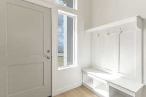 Mudroom with plenty of natural light and light wood-style flooring