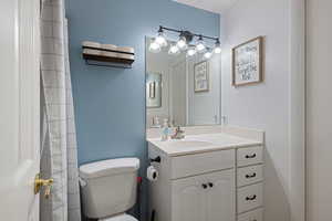 Bathroom with vanity and a shower with curtain