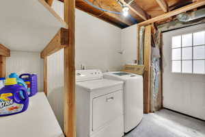 Washroom featuring independent washer and dryer
