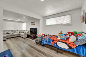 Bedroom featuring light wood-style flooring and recessed lighting