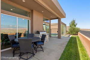 View of patio featuring outdoor dining space and area for grilling