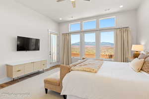 Bedroom with light wood-style floors, access to outside, a ceiling fan, and recessed lighting