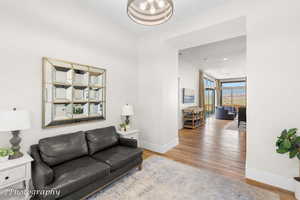 Living area featuring light wood-type flooring and baseboards