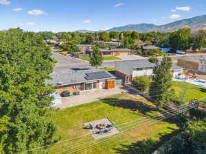 Aerial perspective of suburban area with a mountainous background