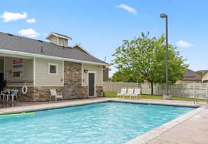 Community pool with a patio area