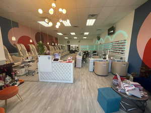Reception with a drop ceiling and a chandelier