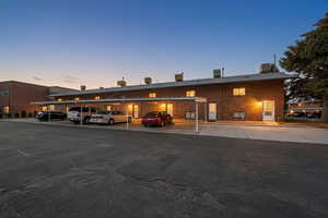 Exterior view of building with assigned covered parking