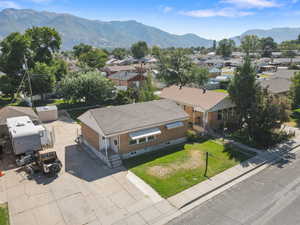 Aerial view of residential area featuring a mountainous background