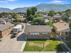 Aerial perspective of suburban area featuring a mountain backdrop