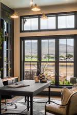 Sunroom with a mountain view and plenty of natural light