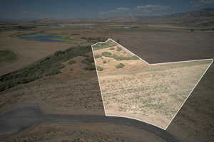 View of property location with rural landscape, property boundaries highlighted, and a mountainous background