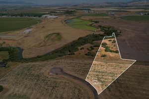 View of property location with rural landscape, property parcel outlined, and a mountainous background