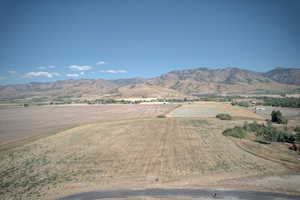 View of mountain backdrop featuring rural landscape