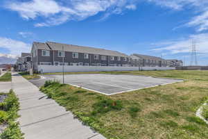 Uncovered parking lot featuring a residential view