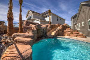 View of pool with a water slide