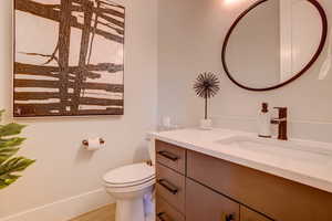 Bathroom featuring vanity and toilet