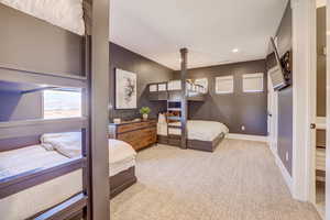 Bedroom with light carpet and recessed lighting