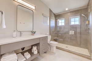 Full bathroom featuring a stall shower, vanity, light tile patterned floors, and recessed lighting