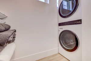 Laundry area featuring estacked washer and dryer